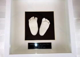 Feet in White Shadow Box